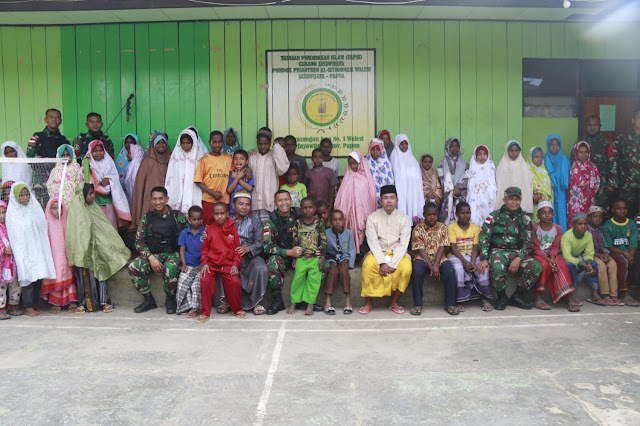 Satgas Yonif MR 412 Kostrad Berbagi Tali Asih Dengan Santri Istiqomah Walesi Wamena