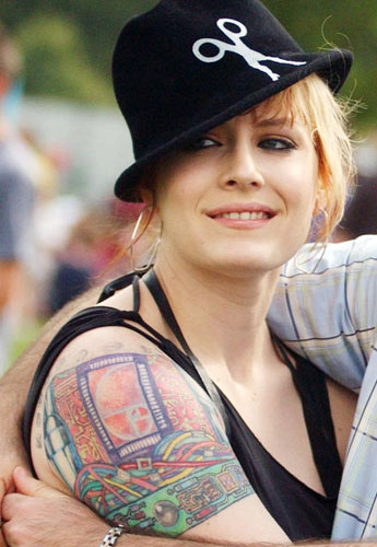 single tattoo located on her right shoulder which appears to be bionic