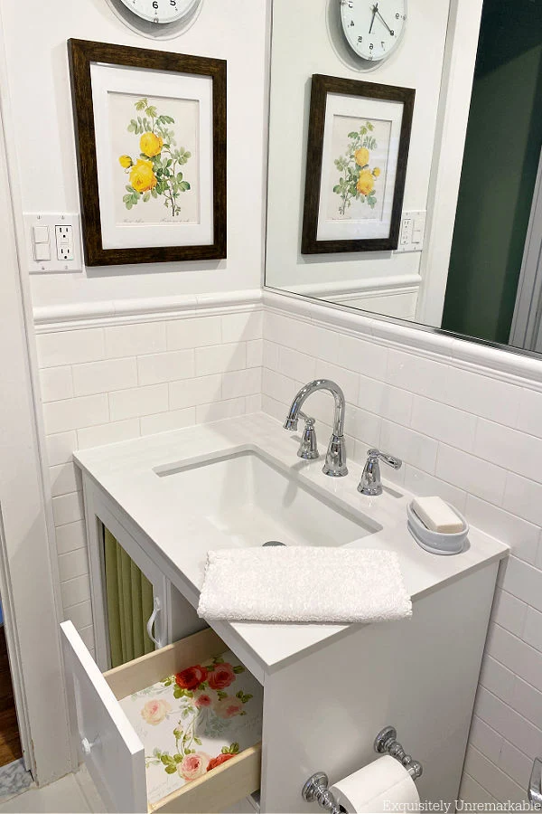 Floral Lined Vanity Drawers and flower painting on wall of bathroom