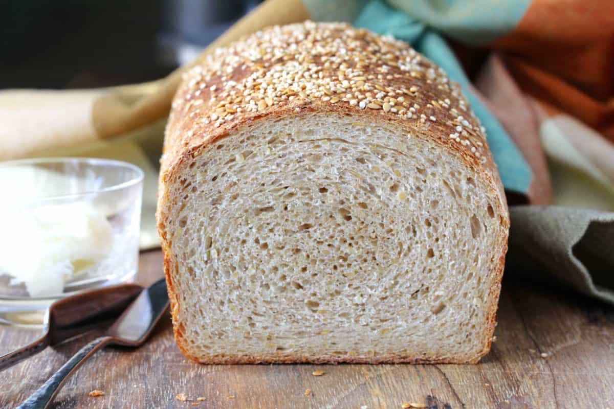 Whole Wheat Quinoa Bread crumb shot, with loaf cut in half.