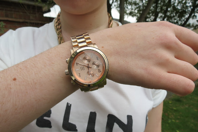 a photo of rose gold river island watch like michael kors dupe