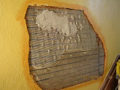 Large plaster wall patch with metal lath in Snyder, NY