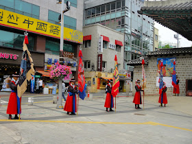 Royal guards with flat in front of Deoksugung Palace Seoul