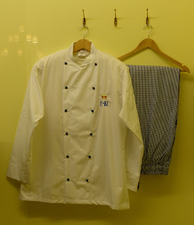 Uniform in the kitchen display in a Royal Welcome  2015 exhibition at Buckingham Palace  Photo © Andrew Knowles