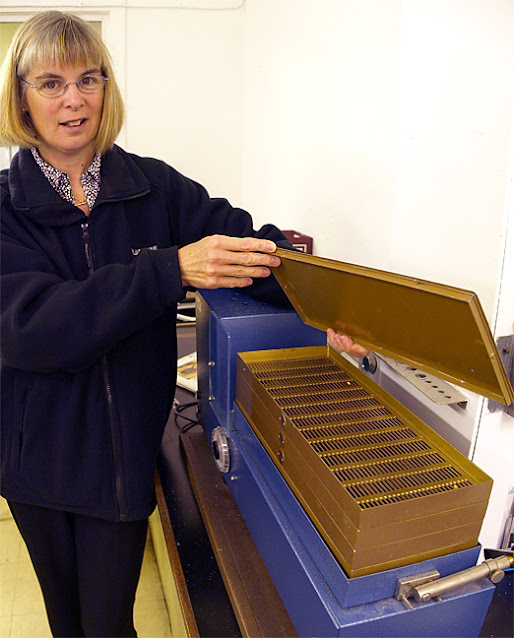 Heather Anderson opens the lid of the barley screener at Tamdhu Distillery