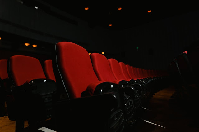 empty cinema theatre chairs