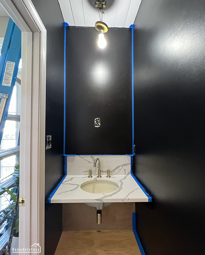 Modern powder room makeover with a stenciled design