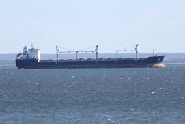 small Summer whitecaps, large ship on Superior