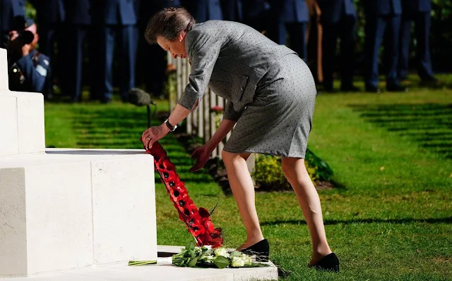 Princess Anne wore a slate grey skirt suit splashed with navy polka dots, a pair of black leather pumps