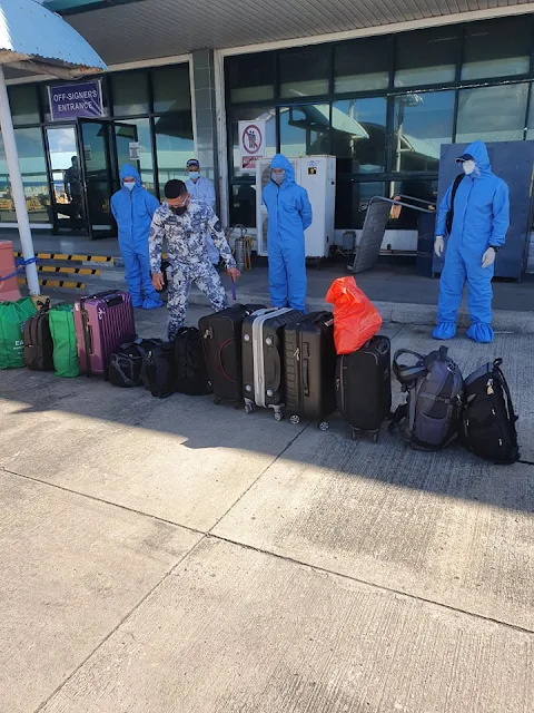 security personnel inspecting baggage of joining seafarers at Batangas Port