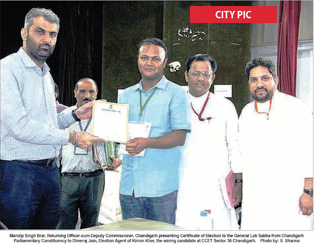 Mandip Singh Brar, Returning Officer-cum-Deputy Commissioner, Chandigarh presenting Certificate of Election to the General Lok Sabha from Chandigarh Parliamentary Constituency to Dheeraj Jain, Election Agent of Kirron Kher, the wining candidate at CCET Sector 26, Chandigarh