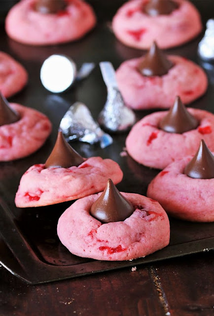 Cherry Kiss Cookies on Baking Sheet Image