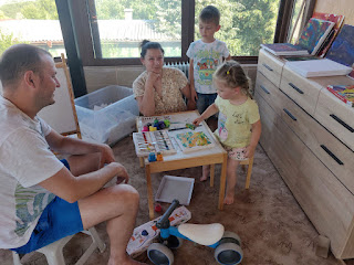 Rosie paints while our friends watch