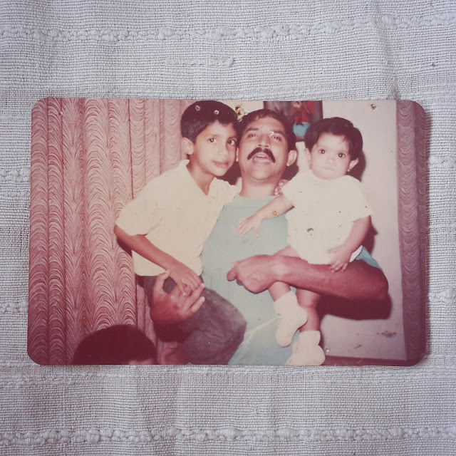 Childhood photograph of Dayle Pereira, blogger at Style File as a baby with he father and brother