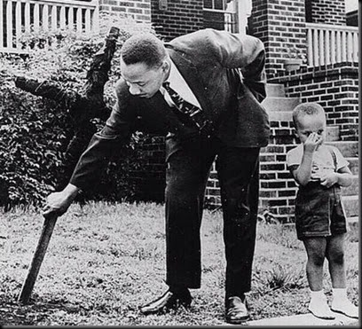 MLK Pulls Cross From Front Yard Lawn