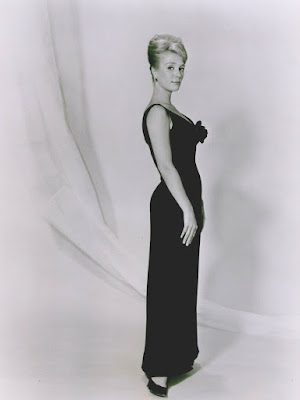 Inger Stevens poses in a black dress in this full-length photograph.