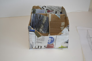 Her ser dere boksen min med avispapir