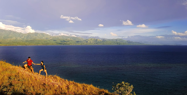 At the ridge-side of Lantawan Peak in Mararison Island with mainland Antique in the background || GREGG YAN