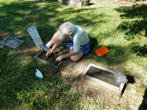 cleaning a grave marker