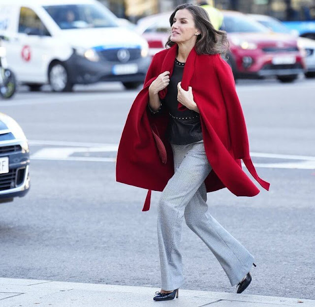 Queen Letizia wore a leather peplum top by Uterqüe. Hugo Boss Catifa wool cashmere shawl-collar red coat. Mango