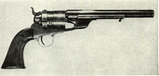 Percussion Army revolvers were converted in small quantities to metallic cartridge for reissue to the post-War cavalry. This regular Ml860 Army Colt has been fitted with ejectorrod housing that fills loading plunger hole, and special breech piece carrying floating firing pin and loading gate. Several thousand regular New Model Army Colts were returned to factory by Ordnance to have this change made.