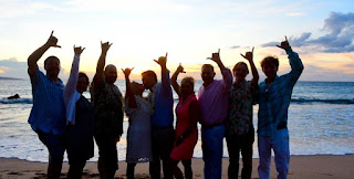 Couple at the beach shaka