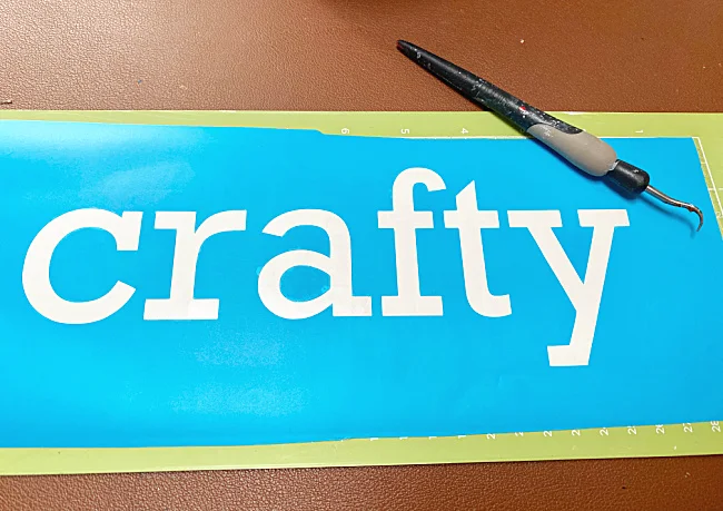 stencil vinyl with the word Crafty