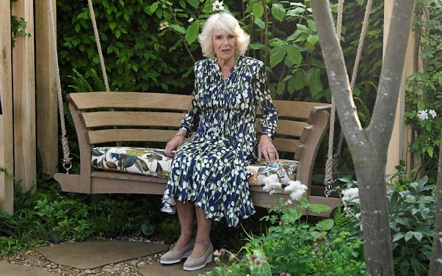 Queen Camilla wore a floral print silk shirt dress by Suzannah. Royal Horticultural Society Great Spring Show