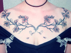 Cherry Blossom Tattoo Design on Female Chest Tattoo