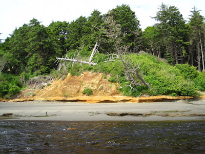 A lone colorful hill on an otherwise desolate beach