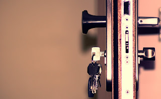 A photo of keys hanging off a door.