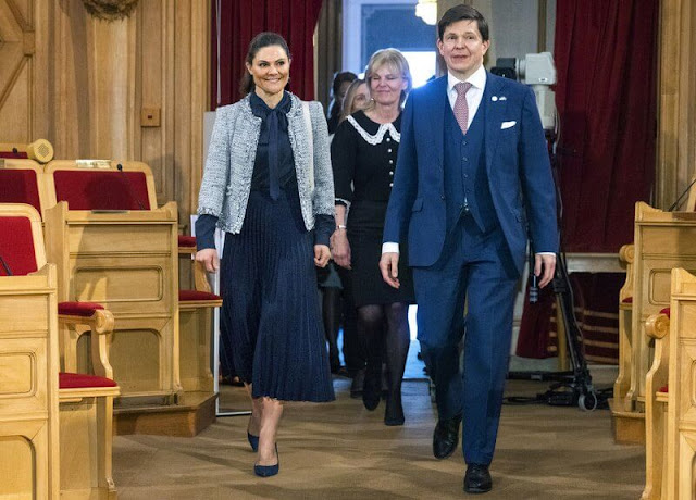 Crown Princess Victoria wore a tweed jacket from Mayla, and a navy silk blouse and navy pleated skirt from H&M