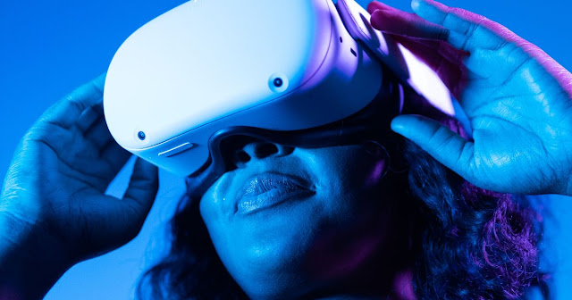 this is a picture of a girl with a virtual reality headset on showing it as a must have mobile phone accessory in 2023