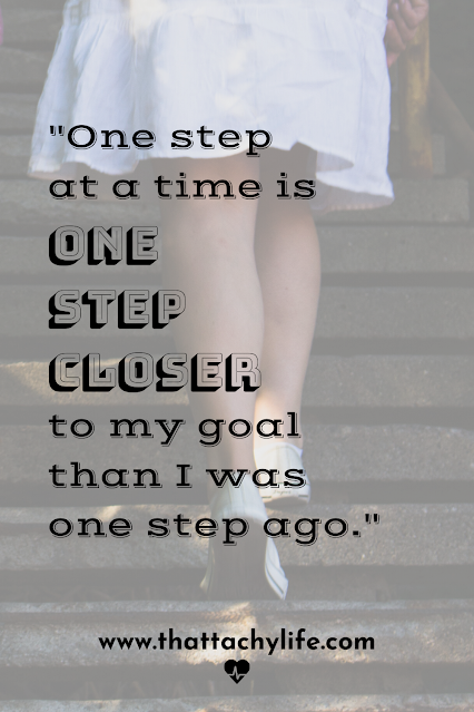 Quote from POTS syndrome blog: "One step at a time is one step closer to my goal than I was one step ago." In the background is a girl walking up concrete steps. The girl is wearing a knee-length white skirt and white Converse sneakers.