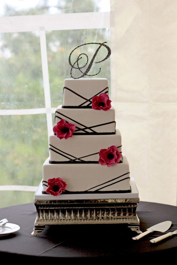 The modern style wedding cake incorporated their wedding colors which 