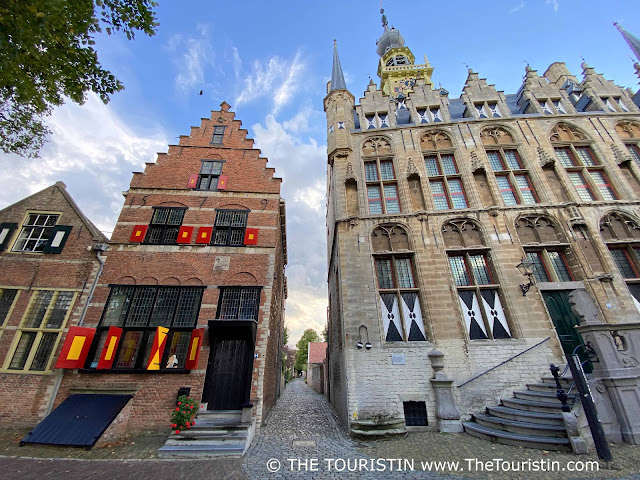 Colourful Dutch gabled period houses on a square.