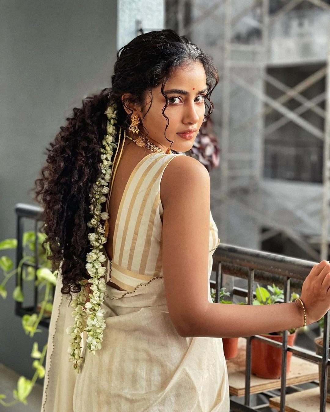 Anupama Parameswaran graceful looking in white Saree