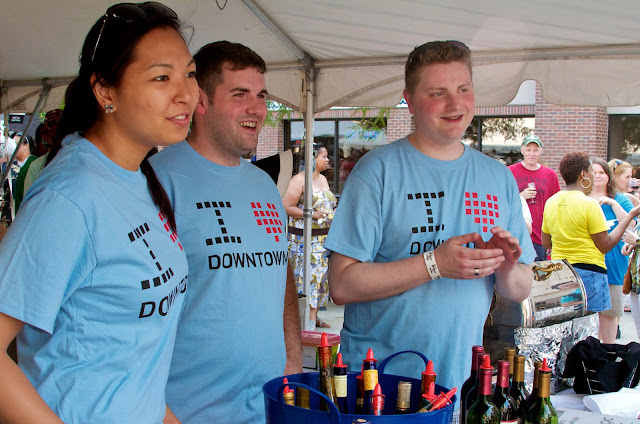 Taste of Downtown in Lansing, Michigan. Volunteers serve wine samples.