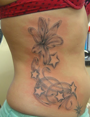 seven star tattoo. flower star tattoo.