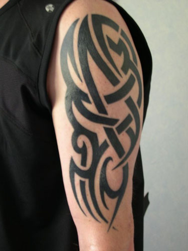 Tribal Tattoo Designs Cross. arm tribal tattoo pictures.