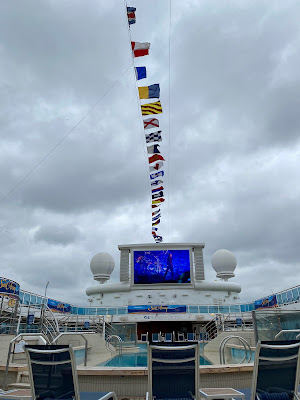 nation flags flying over under Movie Under the Stars Princess Cruises