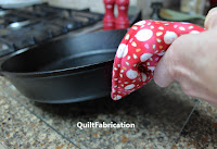 holding a pan with a handle cover