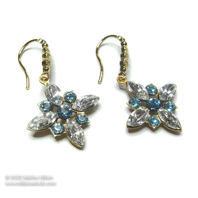 Aquamarine and clear Swarovski crystals set into star shaped brass cup earring findings