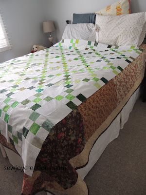 side view irish chain quilt top on queen size bed