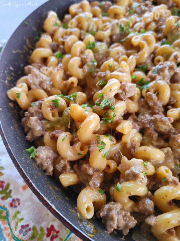 The BEST Philly Cheesesteak Pasta! A family-sized pasta recipe with seared ground beef, green bell peppers, onions and seasoned pasta folded into a velvety Philly-style cheese sauce.