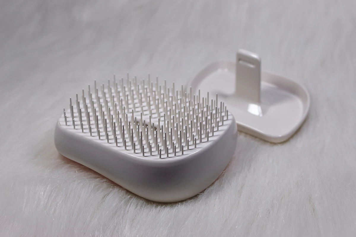 close-up of Compact Styler by Tangle Teezer on a white background