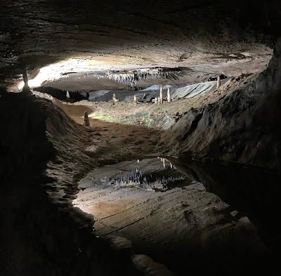 Stalactites reflected in an underground pool