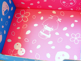A photo showing the inside of a box decorated with cute Japanese-themed illustrations