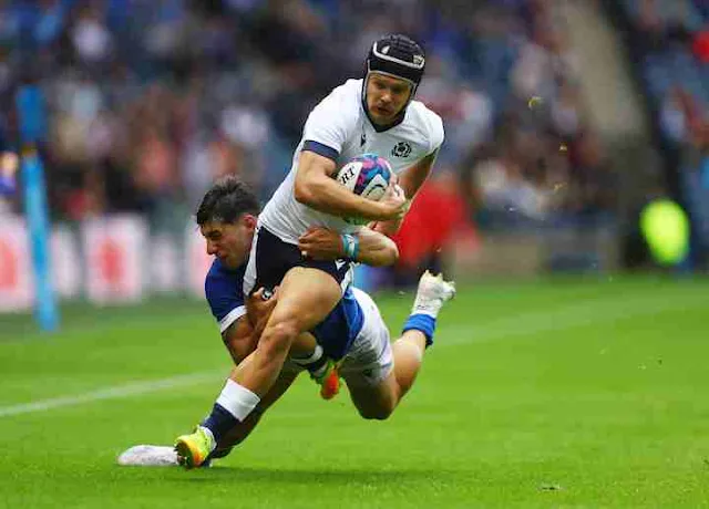 Scotland's Darcy Graham in action against Italy's Tommaso Menoncello at Murrayfield Stadium in Edinburgh, Scotland, on July 29, 2023. Photo by Lee Smith/Reuters