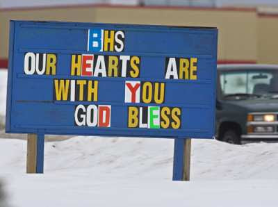 A sign outside a youth centre in Bathurst, N.B. reflects the sorrow that embraces the community Saturday after a van carrying the Bathurst High Phantoms basketball team collided with a transport truck while returning from a game early in the morning. Seven members of the team died. (Andrew Vaughan/The Canadian Press)